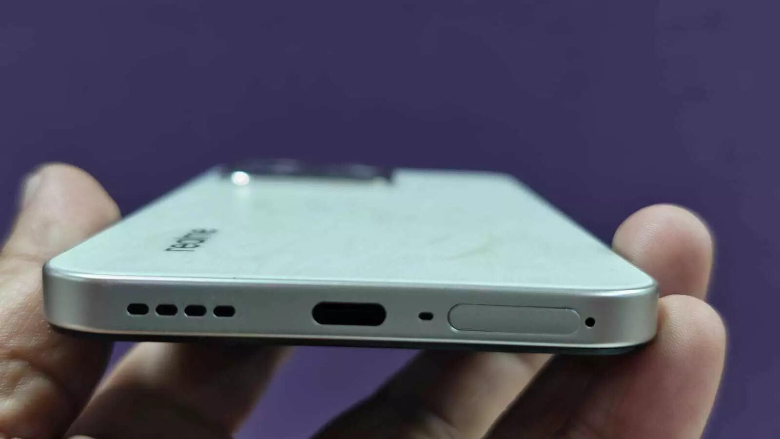 Realme 15T's speaker grille, USB-C charging port and SIM slot