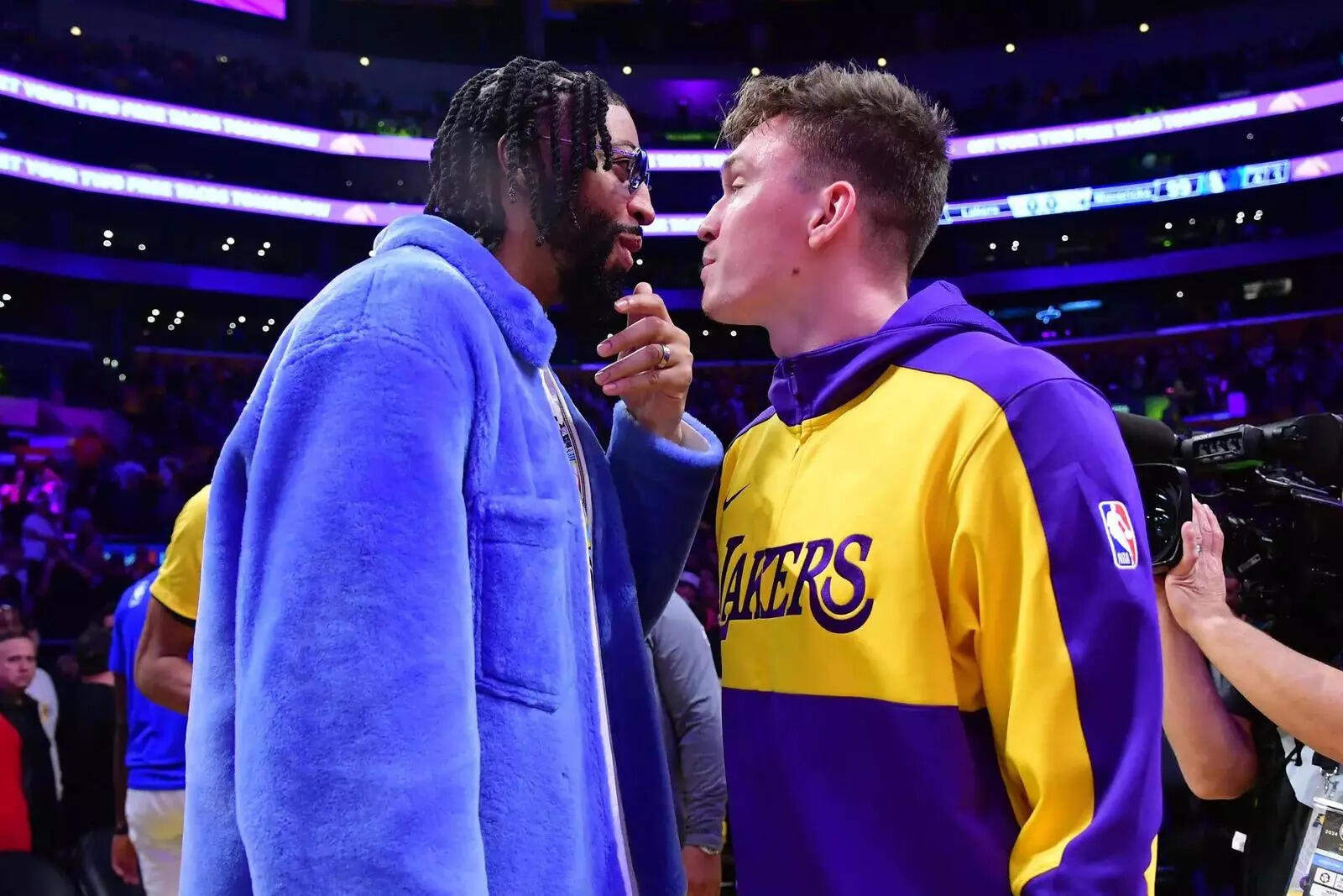 Dallas Mavericks forward Anthony Davis (left) reacts with Los Angeles Lakers guard Dalton Knecht (right) after the game at Crypto.com Arena