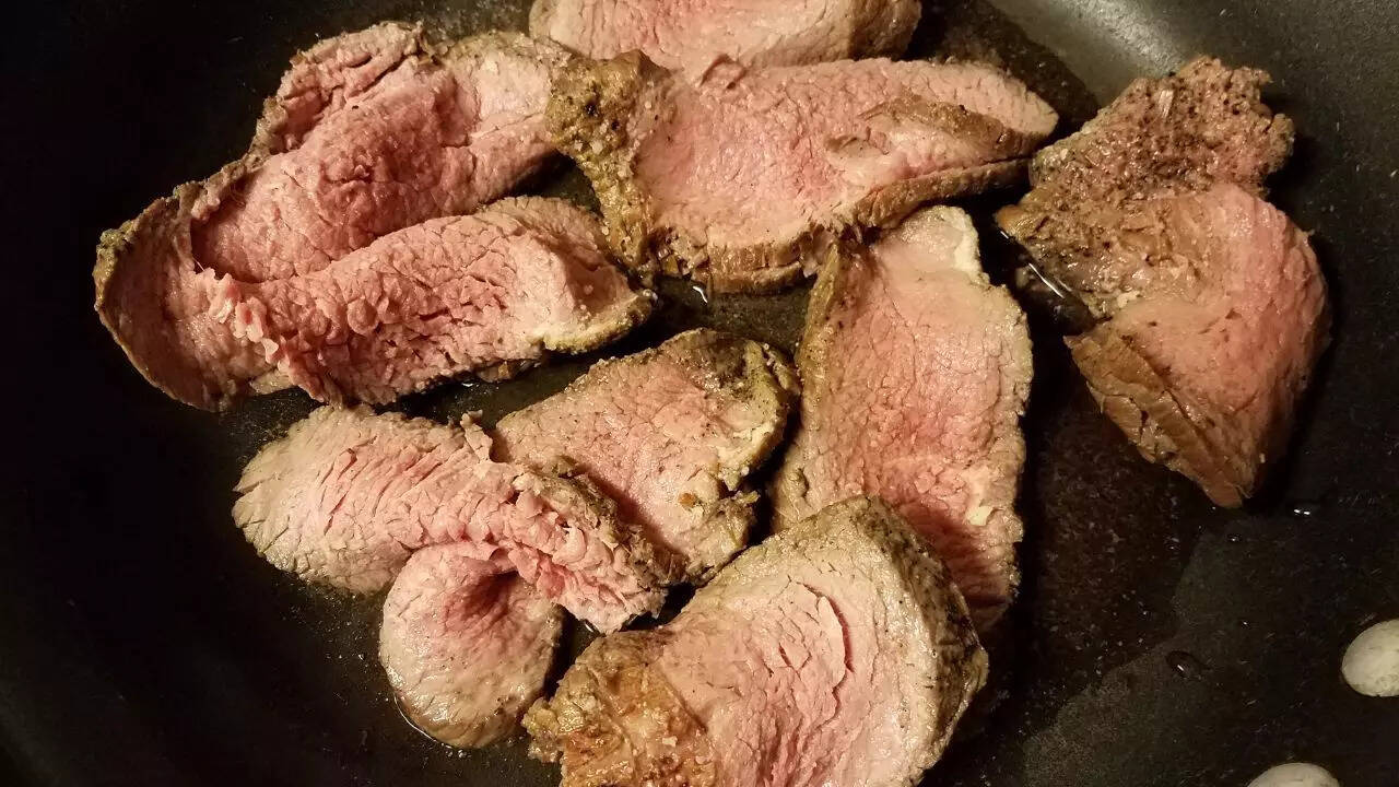 Consuming raw or undercooked foods