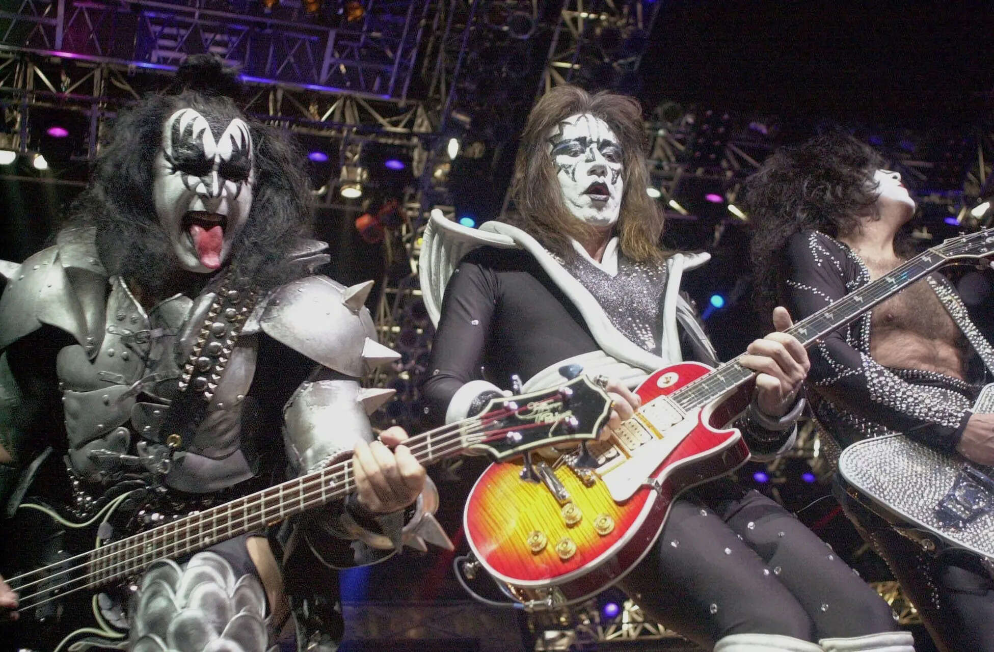 Kiss guitarist Paul Stanley, right, guitarist Ace Frehley, center, and bassist Gene Simmons play during the band's farewell concert in the Detroit area. (File image only for representation) KISS band's Ace Frehley, original lead guitarist and founding member, dies at 74, once electrocuted