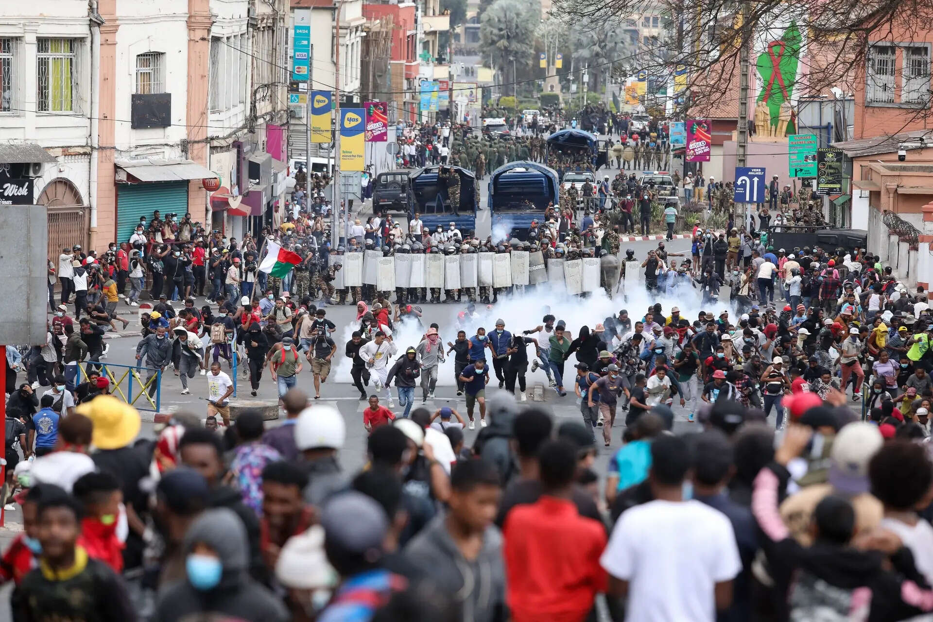 Demonstrators protesting against chronic electricity and water cuts confront riot police in Antananarivo, Madagascar, Tuesday, Sept. 30, 2025. (AP Photo/Mamyrael) Madagascar's Gen Z protesters clash with police as they call for president to step down