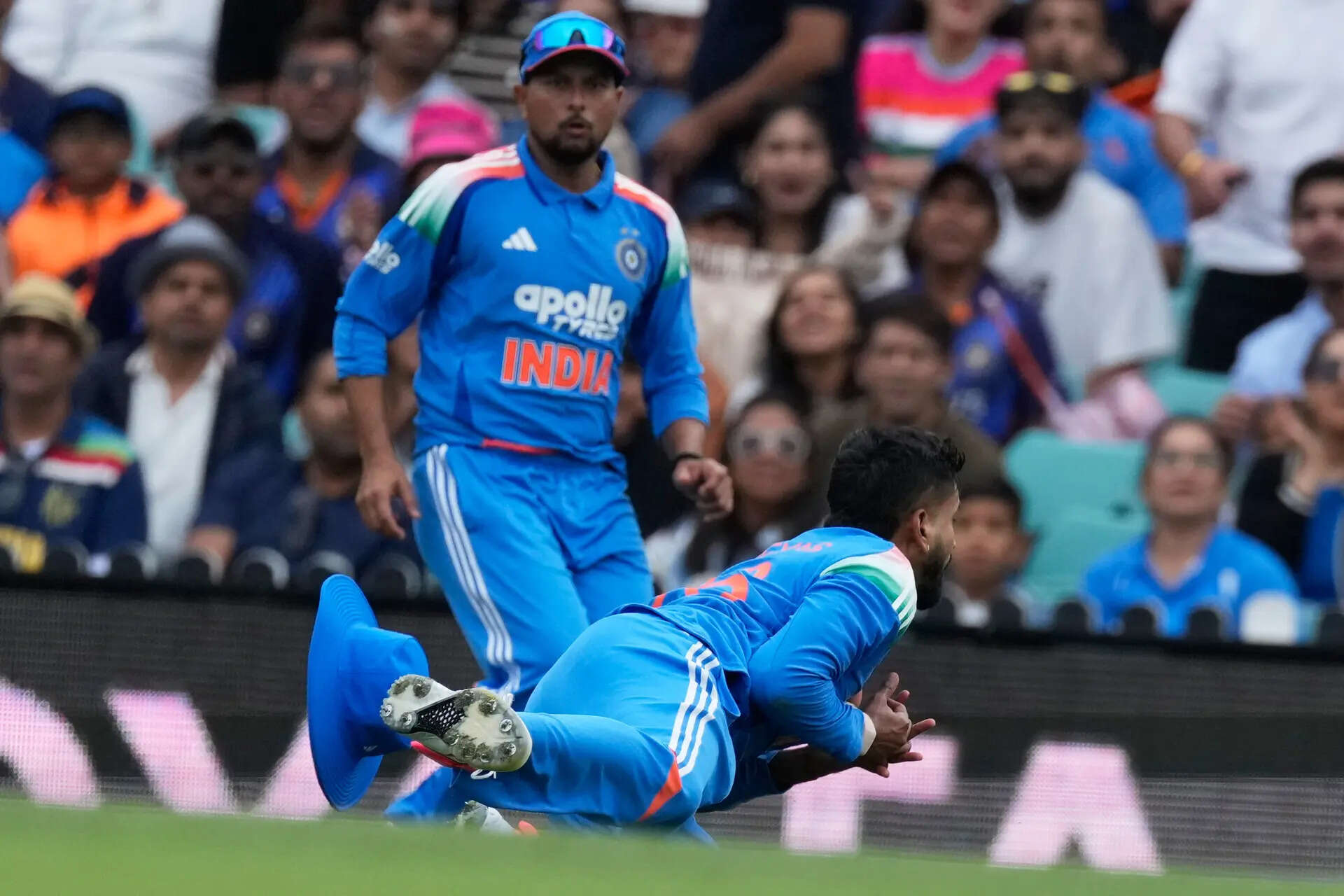 Shreyas Iyer lands awkwardly after taking the catch (AP Photo/Rick Rycroft) Australia India Cricket