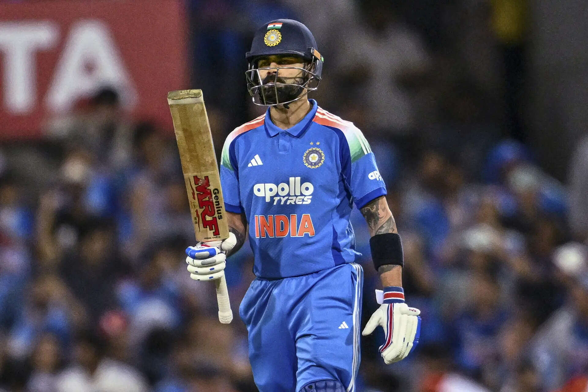 India's Virat Kohli celebrates his half-century (PTI Photo/Izhar Khan) India vs Australia 3rd ODI