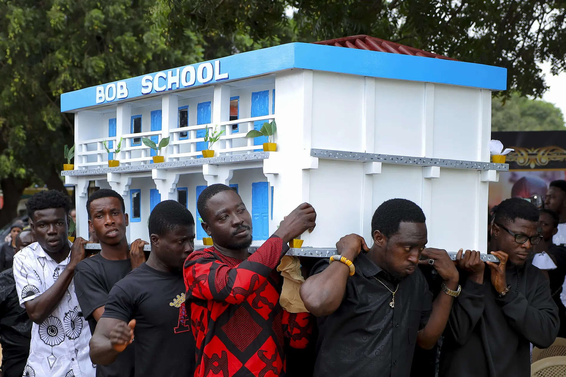 Men carry the fantasy coffin of the late Robert Nii Anang Obodai, a former school proprietor, during his funeral, in Accra, Ghana, Saturday, July 26, 2025. (AP Photo/Misper Apawu) Photos show Ghana's fantasy coffins as a stylish final rest