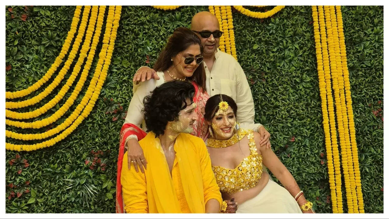Rinku Ghosh and her husband Pawan Jha with the couple at their haldi ceremony Rinku Ghosh and her husband Pawan Jha with the couple at their haldi ceremony