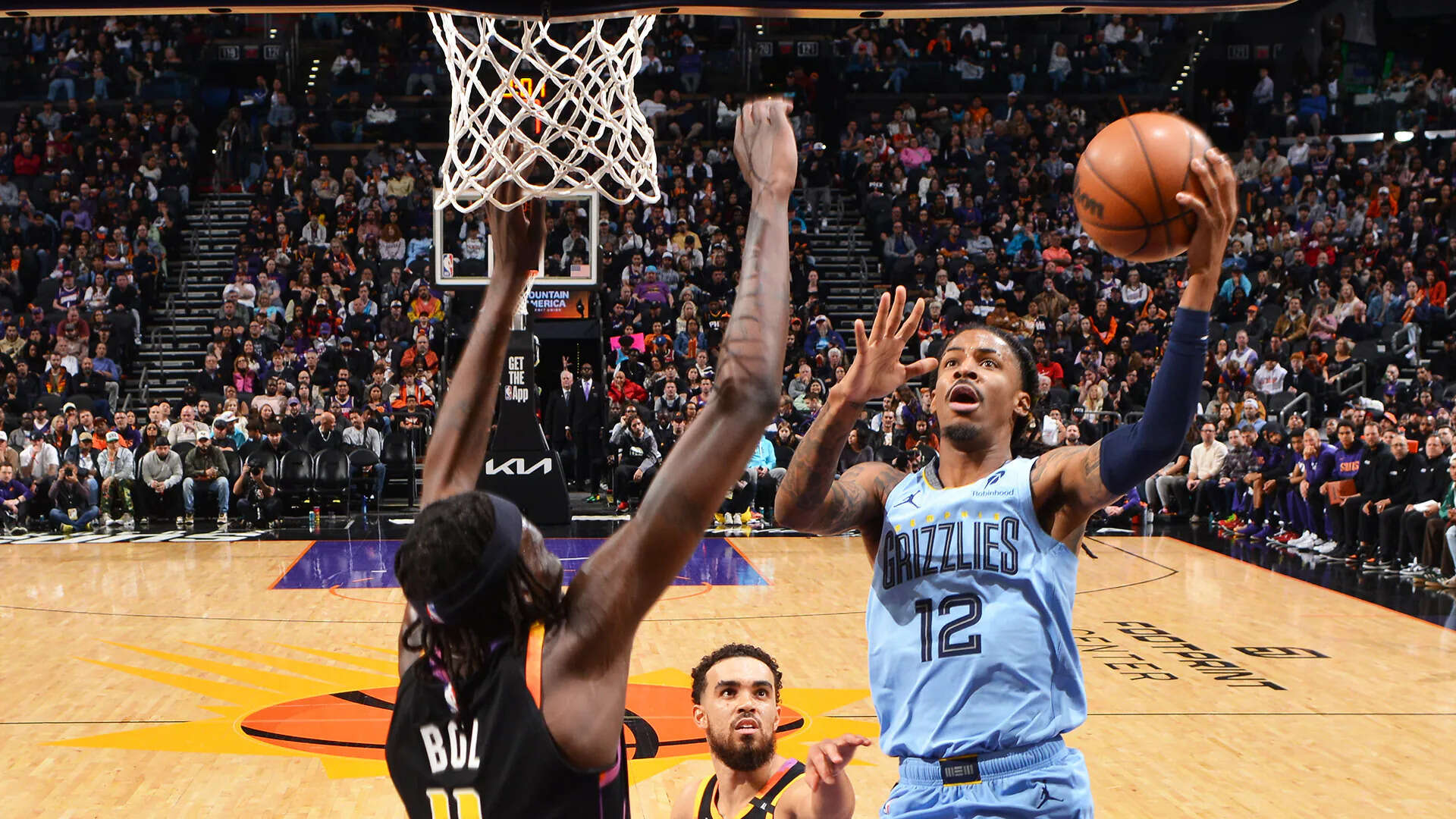 Grizzlies' Ja Morant vs the Phoenix Suns (Image via Getty). Grizzlies' Ja Morant vs the Phoenix Suns