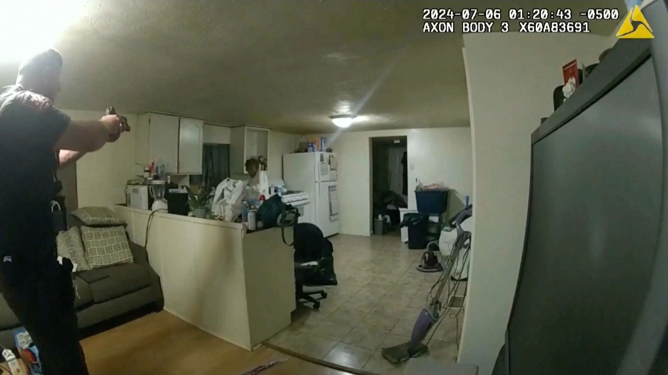 FILE - In this image taken from body camera video released by Illinois State Police on Monday, July 22, 2024, former Sangamon County Sheriff's Deputy Sean Grayson, left, points his gun at Sonya Massey, who called 911 for help, before shooting and killing her inside her home in Springfield, Ill., July 6, 2024. (Illinois State Police via AP, file) Illinois deputy found guilty of murder in the shooting of Sonya Massey, a Black woman who called 911