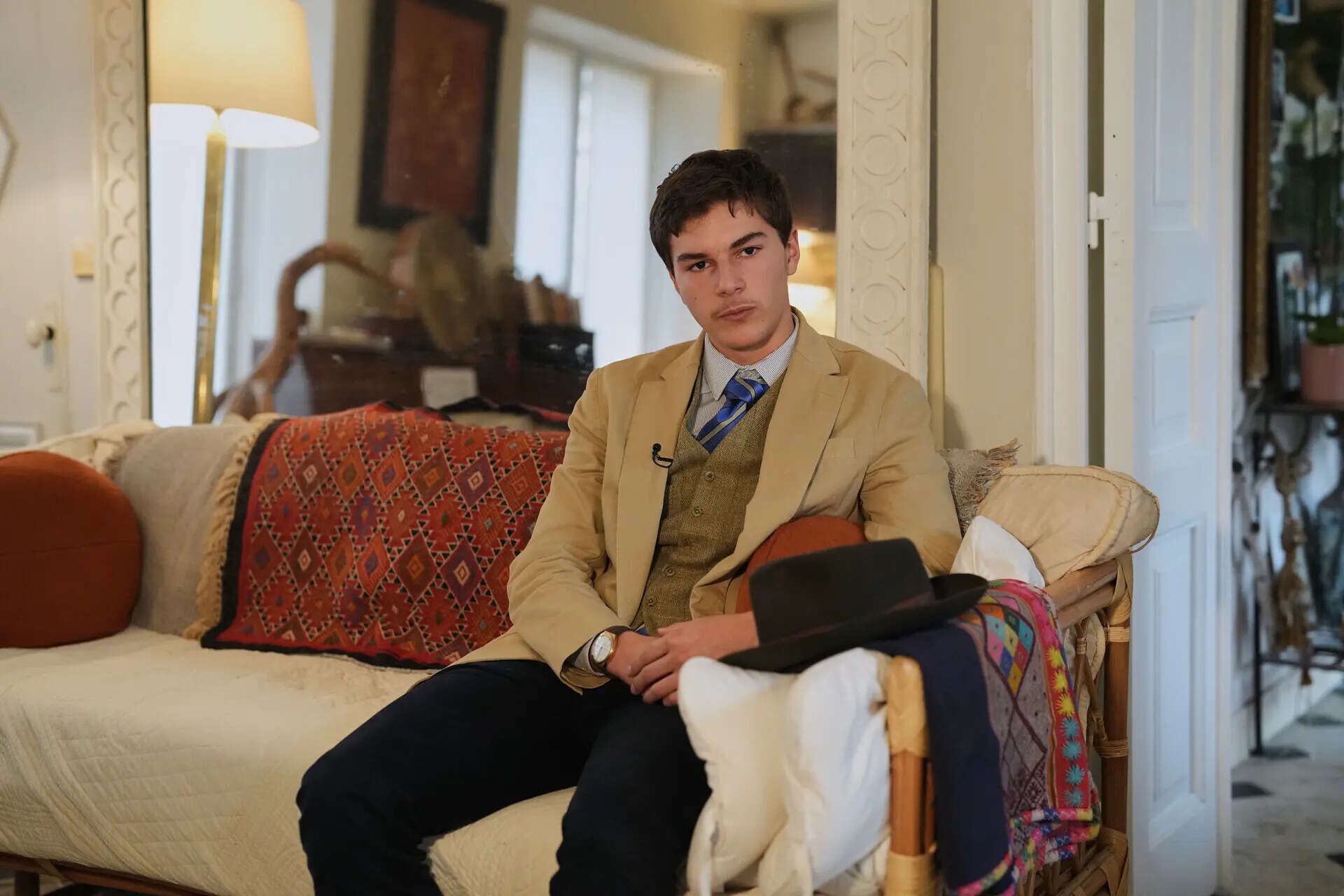 Fedora man unmasked: Meet the teen behind the Louvre mystery photo