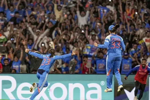 India's captain Harmanpreet Kaur, left, and Harleen Deol celebrate after winning the ICC Women's World Cup final ODI cricket match between India Women and South Africa Women, at the DY Patil Stadium, in Navi Mumbai. (PTI Photo)