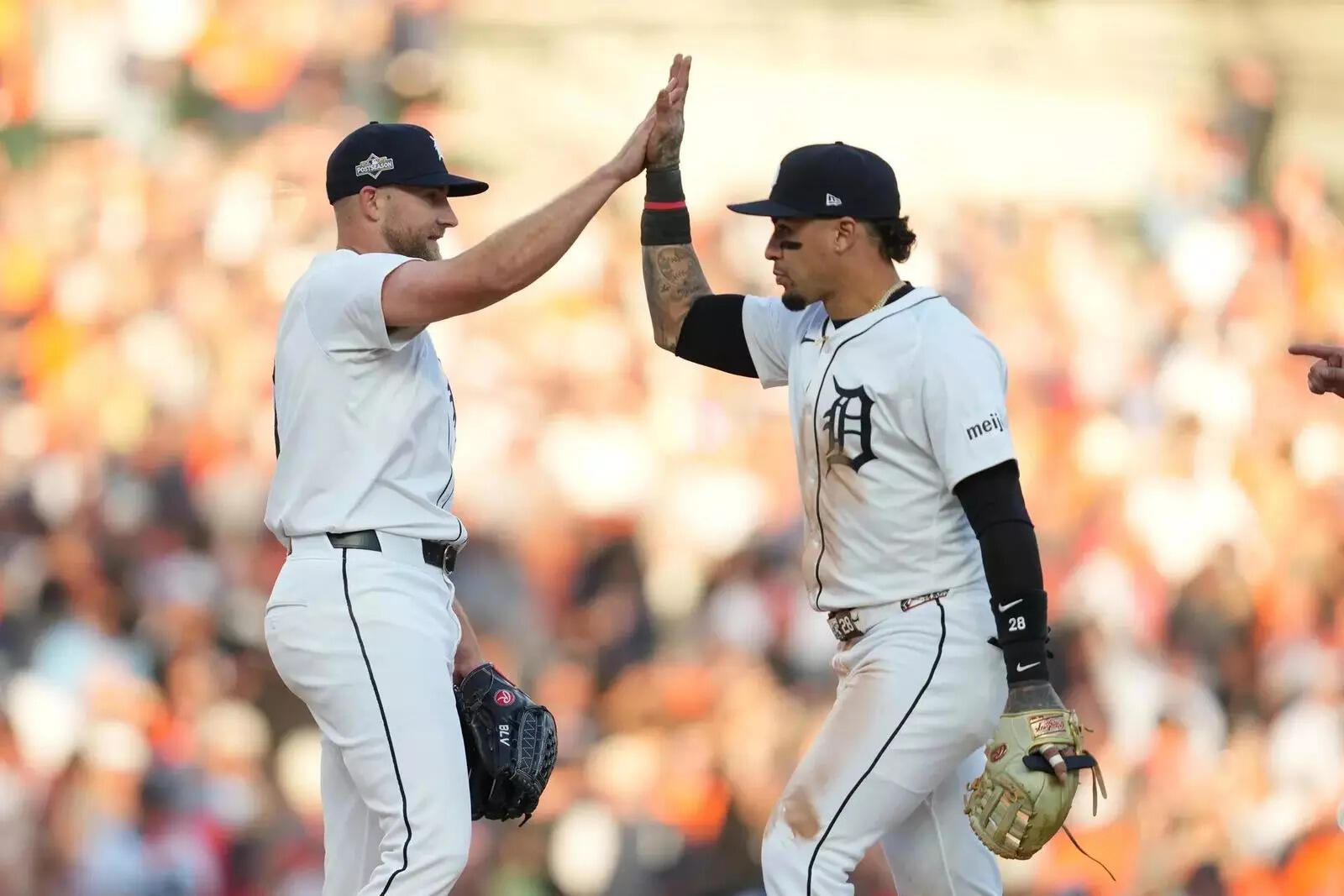 Detroit Tigers' Will Vest and Javier Báez, right, celebrate a victory over the Seattle Mariners