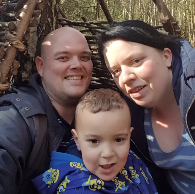 The couple with one of their children (Picture: Adam Kemp/SWNS)