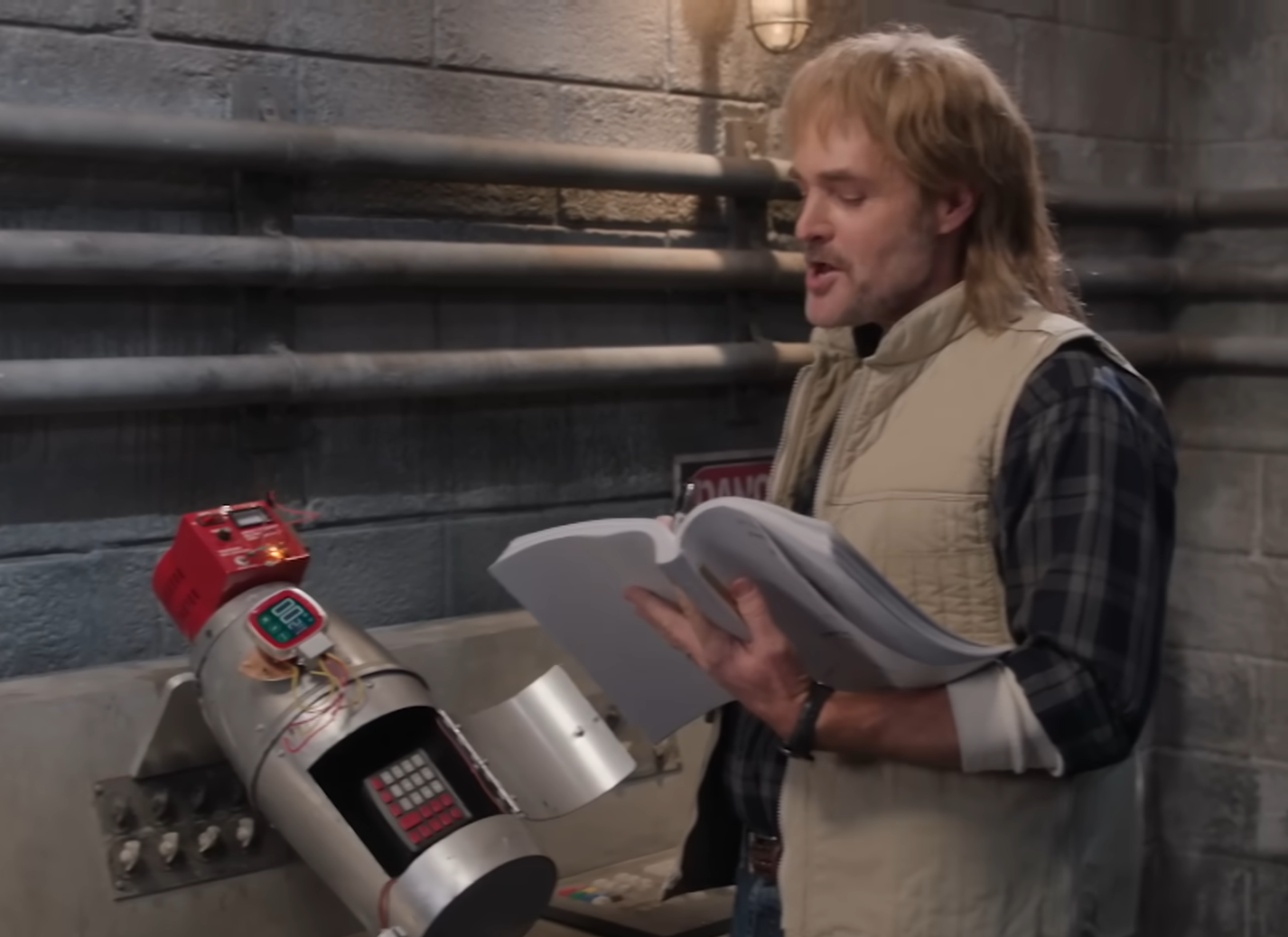 McGruber reading his own name on the Epstein list