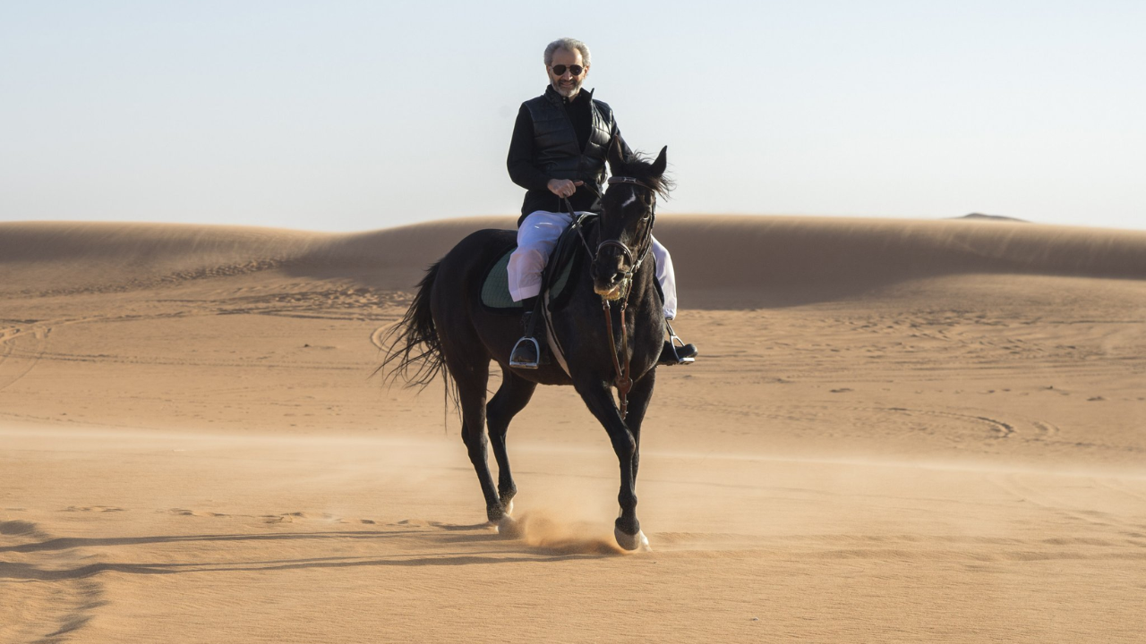 Prince Alwaleed Bin Talal Alsaud rides horseback gracefully across vast desert dunes/Image: X Prince