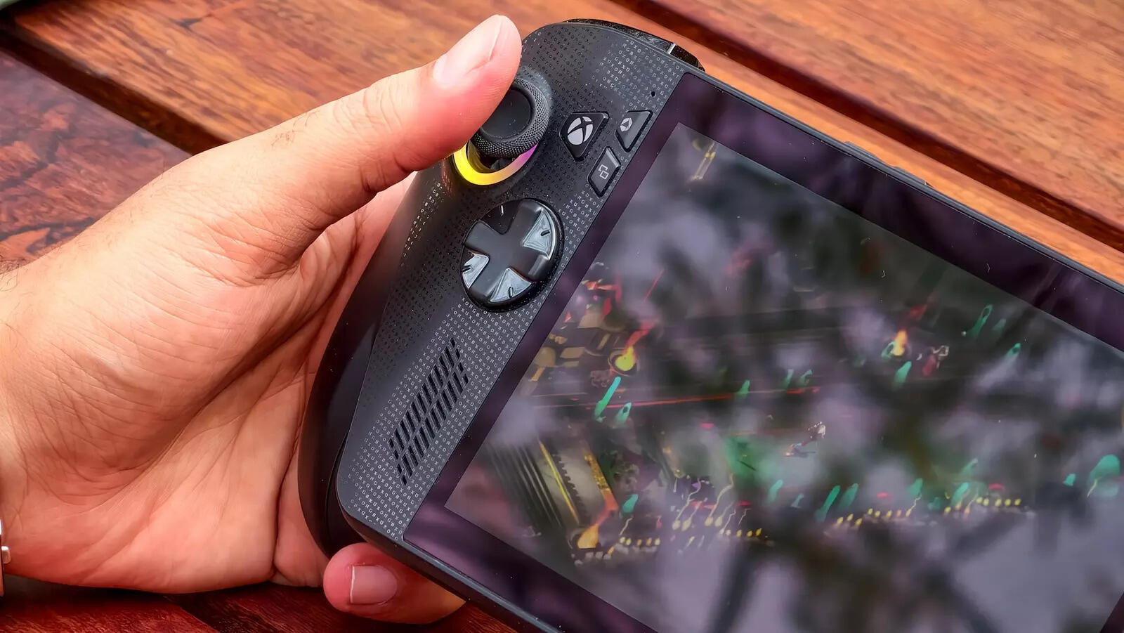 Hall Effect joysticks with RGB lighting rings flanking both sides—flashy, unnecessary, and exactly what you'd expect from a gaming device, though you can disable them entirely.