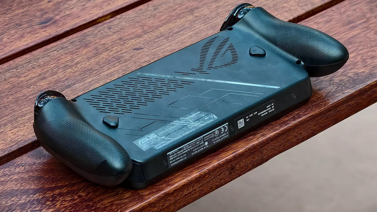 At 715 grams, the weight distributes across sculpted controller handles rather than pressing flat against your palms.