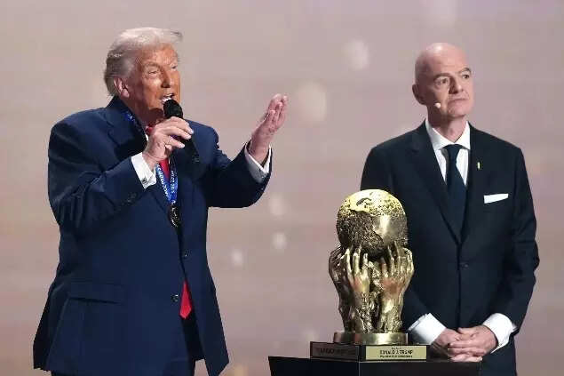 President Donald Trump speaks after being presented with the FIFA Peace Prize by FIFA President Gianni Infantino