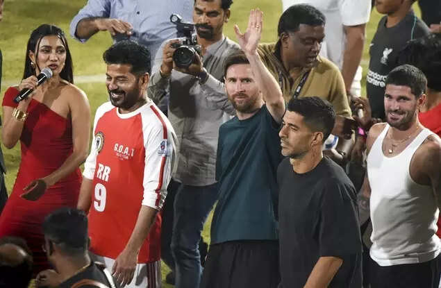 Lionel Messi greets fans during an event as part of the second leg of 'GOAT India Tour 2025', in Hyderabad. Telangana Chief Minister Revanth Reddy and Messi's Inter Miami teammates Rodrigo De Paul and Luis Suarez are also seen. (PTI Photo)