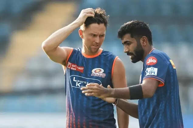 Jasprit Bumrah, right, and Trent Boult during a practice session ahead of an IPL 2025 T20 match between MI and RCB, at the Wankhede Stadium, in Mumbai. (PTI Photo)