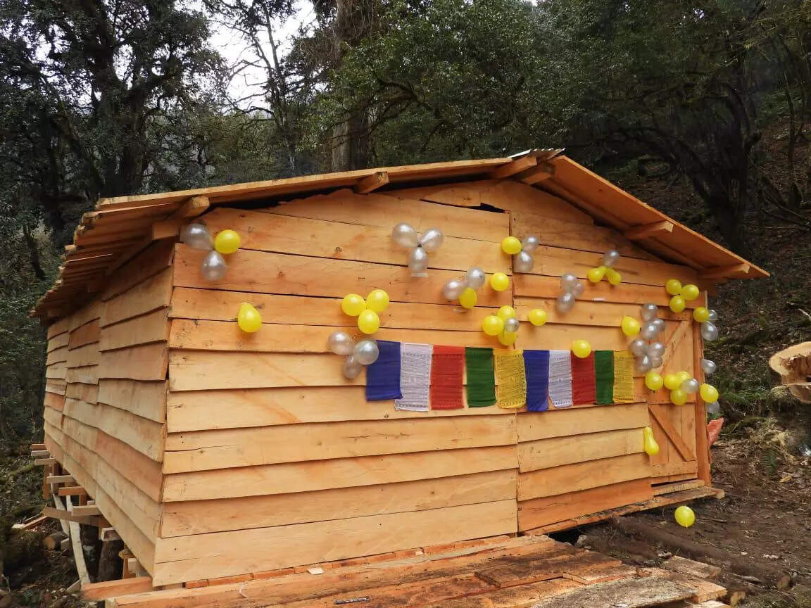 A log hut with a water storage facility built at Ojugo village in Taksing, Upper Subansiri district, Arunachal. Credit: SpearCorps.IndianArmy