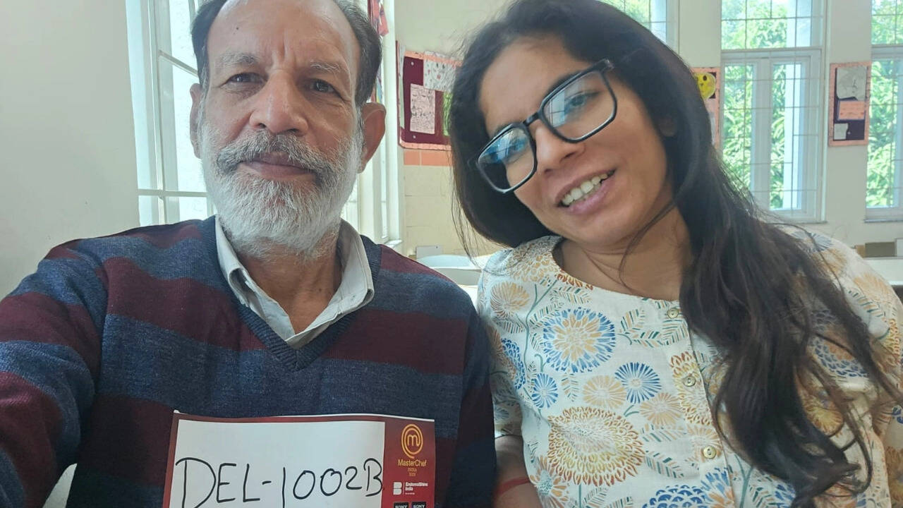 ​​Manisha Sharma and her father (left)