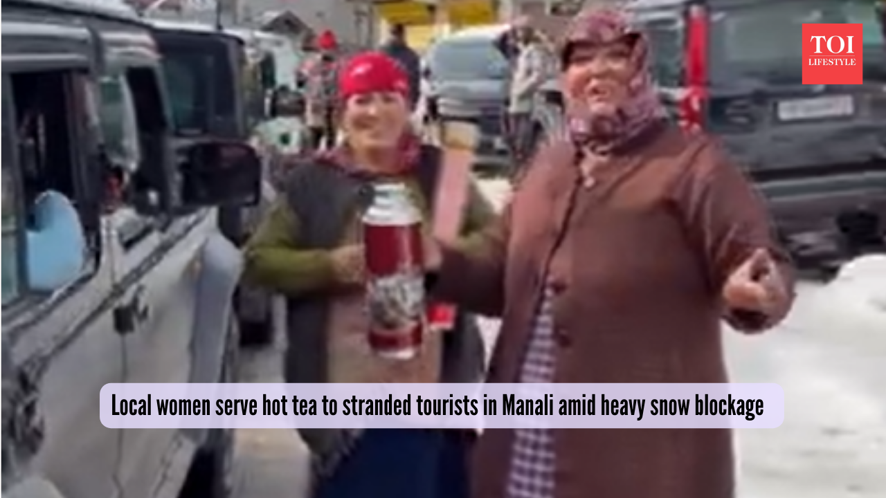 Local women serve hot tea to stranded tourists in Manali amid heavy snow blockage