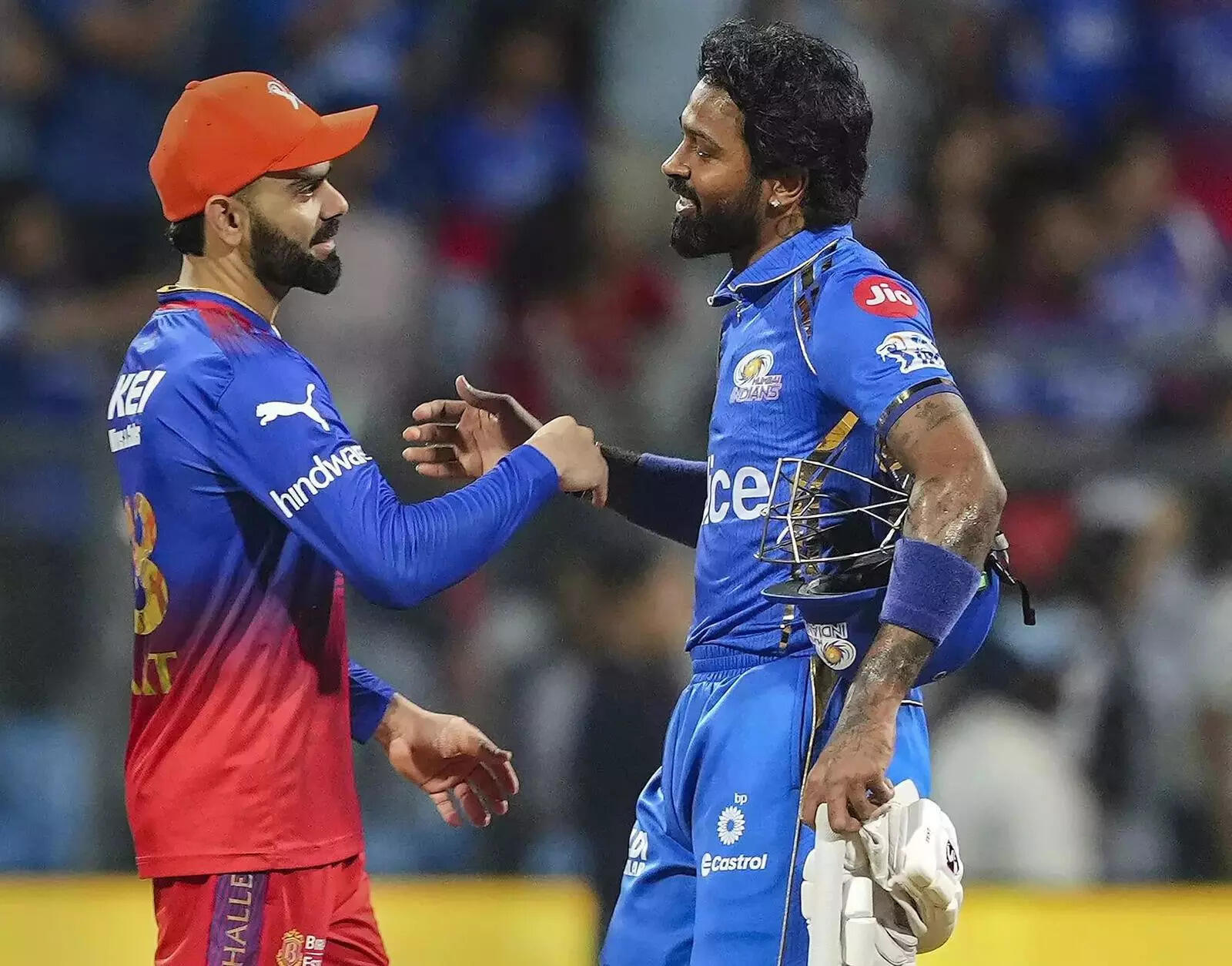 MI captain Hardik Pandya and RCB's player Virat Kohli exchange greetings after the IPL 2024 cricket match at Wankhede Stadium, in Mumbai. Mumbai Indians won the match by 7 wickets. (PTI Photo)