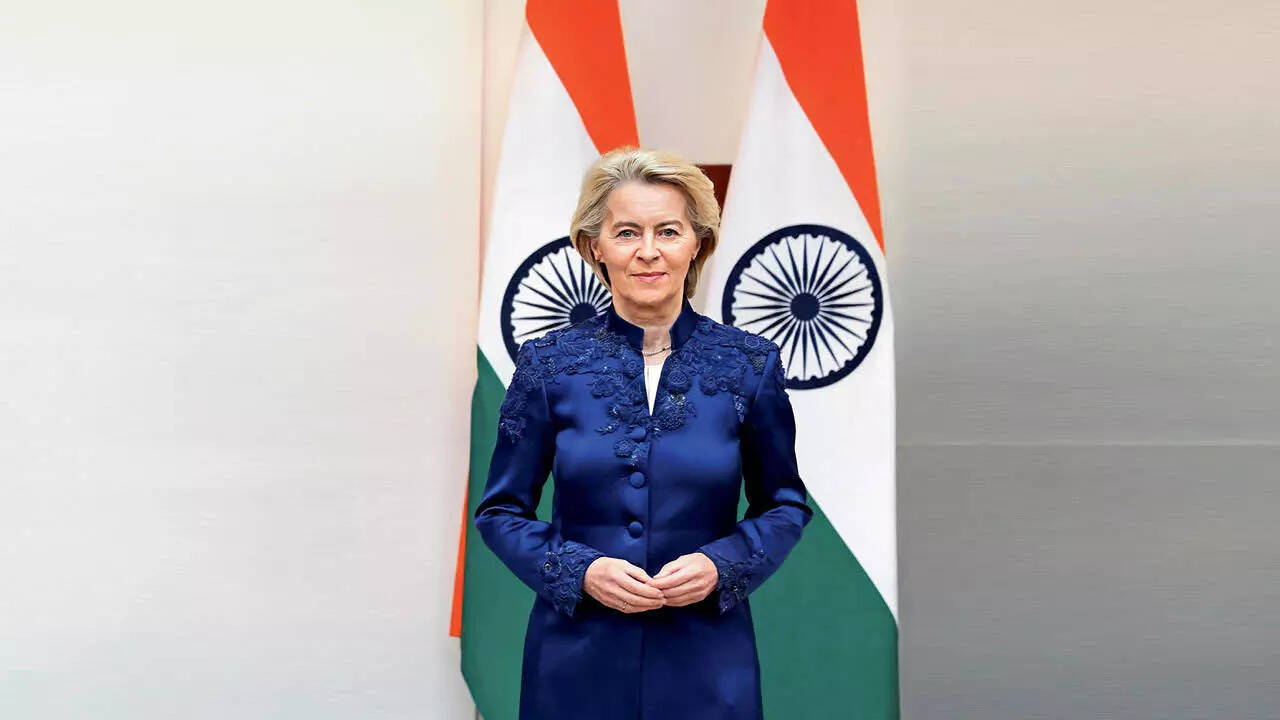 On Tuesday, ahead of the India–EU Summit, the European Commission President was seen wearing a Euro blue silk satin bandhgala by designer Anamika Khanna , featuring delicate resham hand embroidery, handmade lace cut-outs, and 3D detailing, as she visited Rajghat to pay respects to Mahatma Gandhi. She wore the same ensemble for the Summit