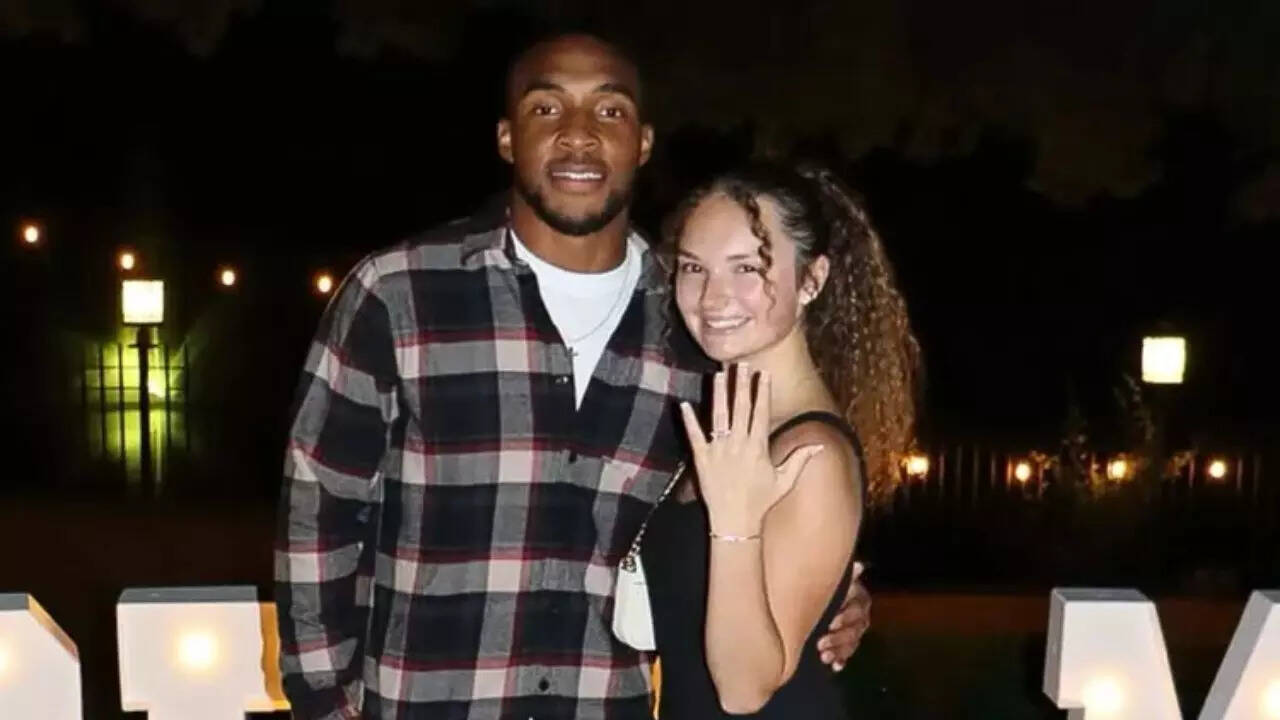 TreVeyon Henderson and his wife.