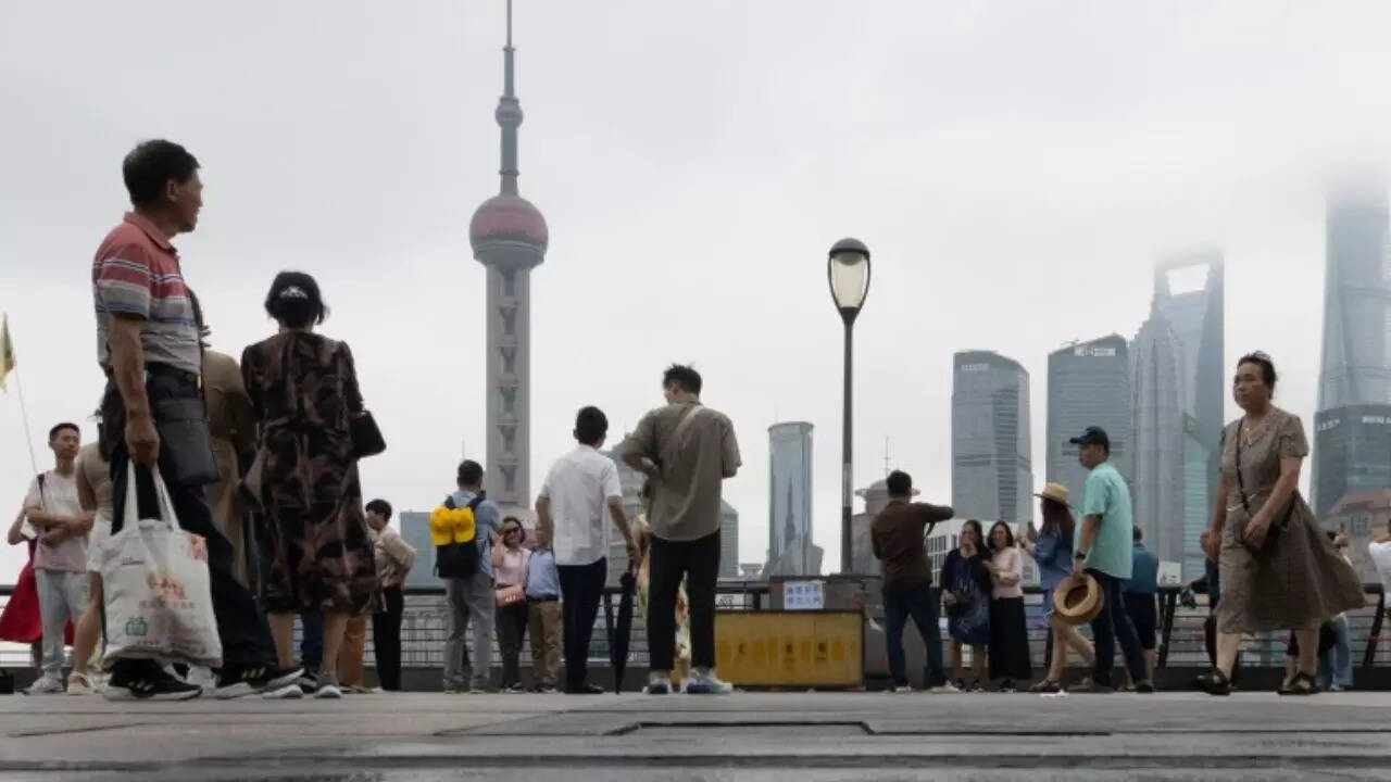 What causes a city like Shanghai to sink