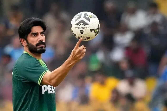 Pakistan's Usman Tariq balances a football on his finger as he warms up before the start of a T20 World Cup cricket match in Colombo, Sri Lanka, Sunday, Feb 15, 2026. (AP Photo)