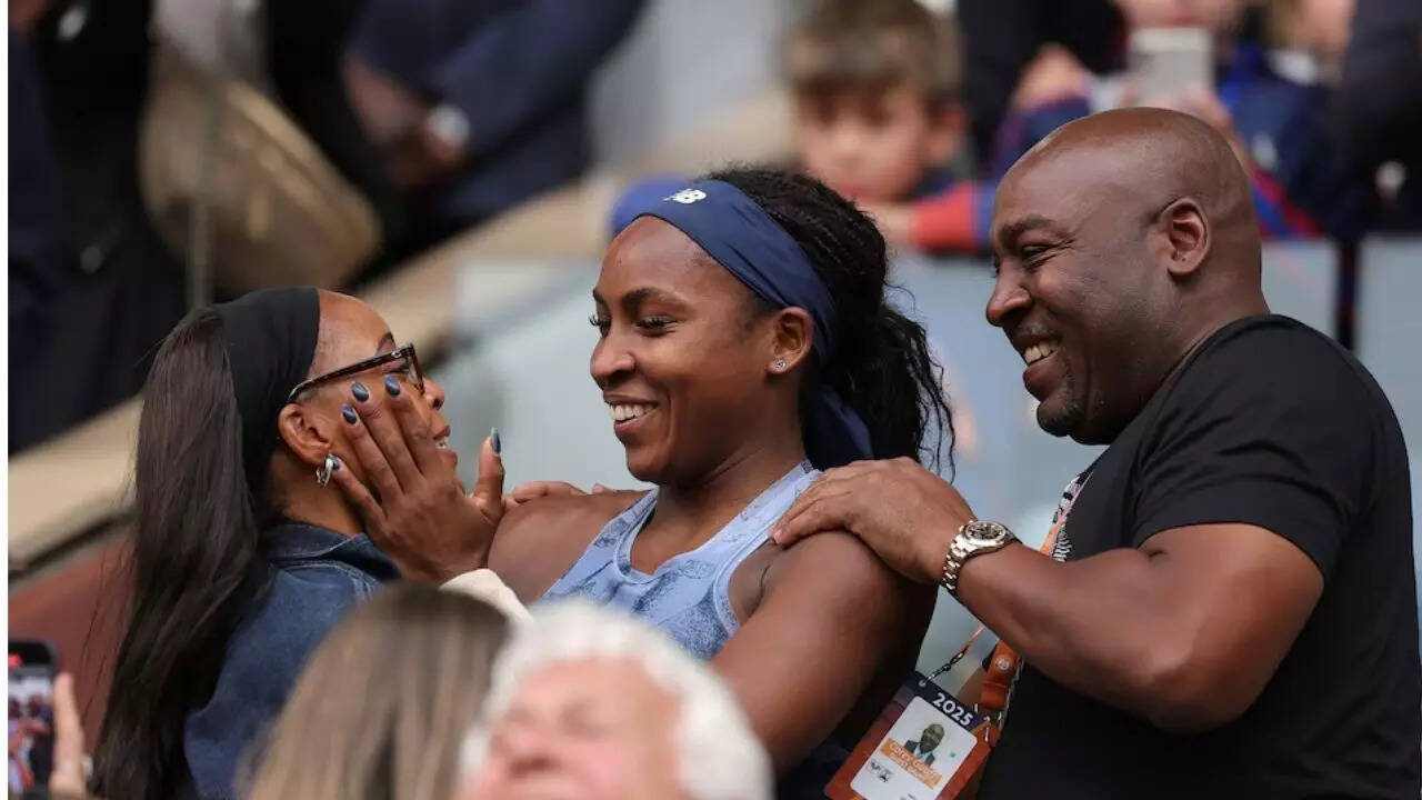 Coco Gauff greets her mother Candi Gauff and father Corey Gauff