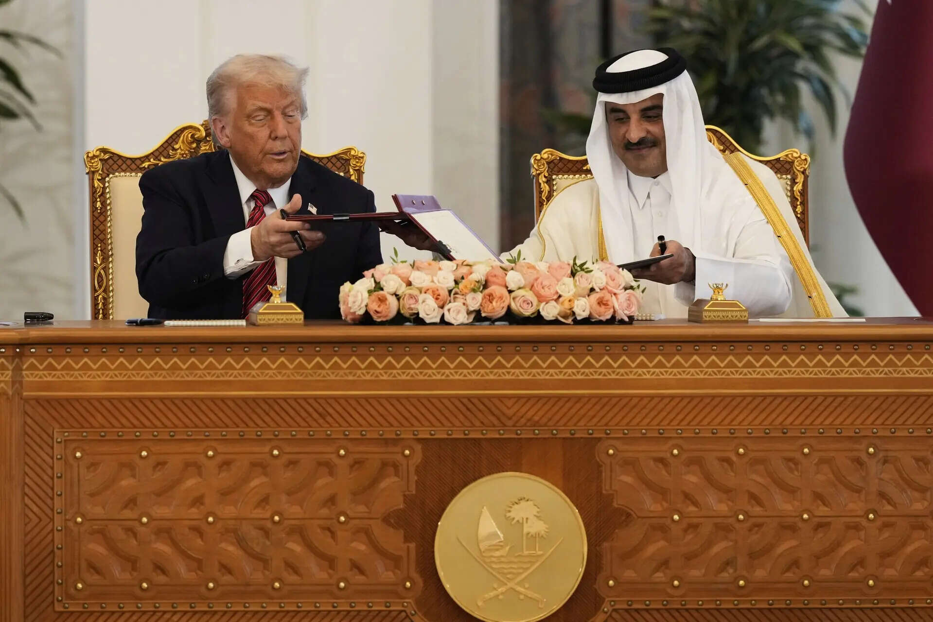 President Donald Trump and Qatar's Emir Sheikh Tamim bin Hamad Al Thani