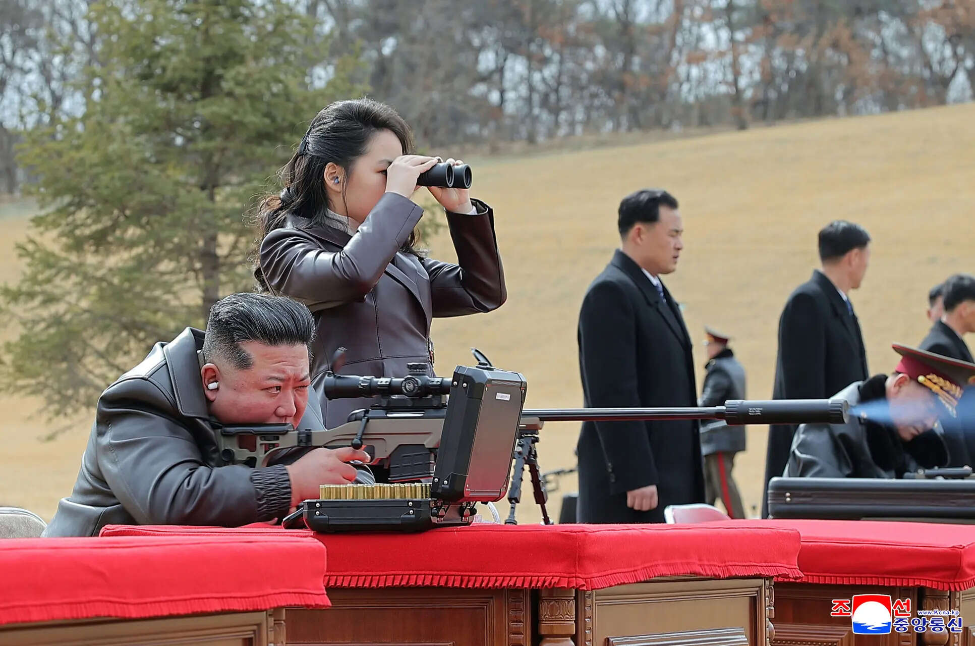 In this photo provided by the North Korean government, its leader Kim Jong Un, left, with his daughter, test-fires a new sniper rifle at a shooting range in an undisclosed location, North Korea Friday, Feb. 27, 2026. (AP)
