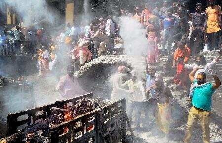 Varanasi: People (Lord Shiva devotees) play Holi with Chita Bhasma (ashes) at th...