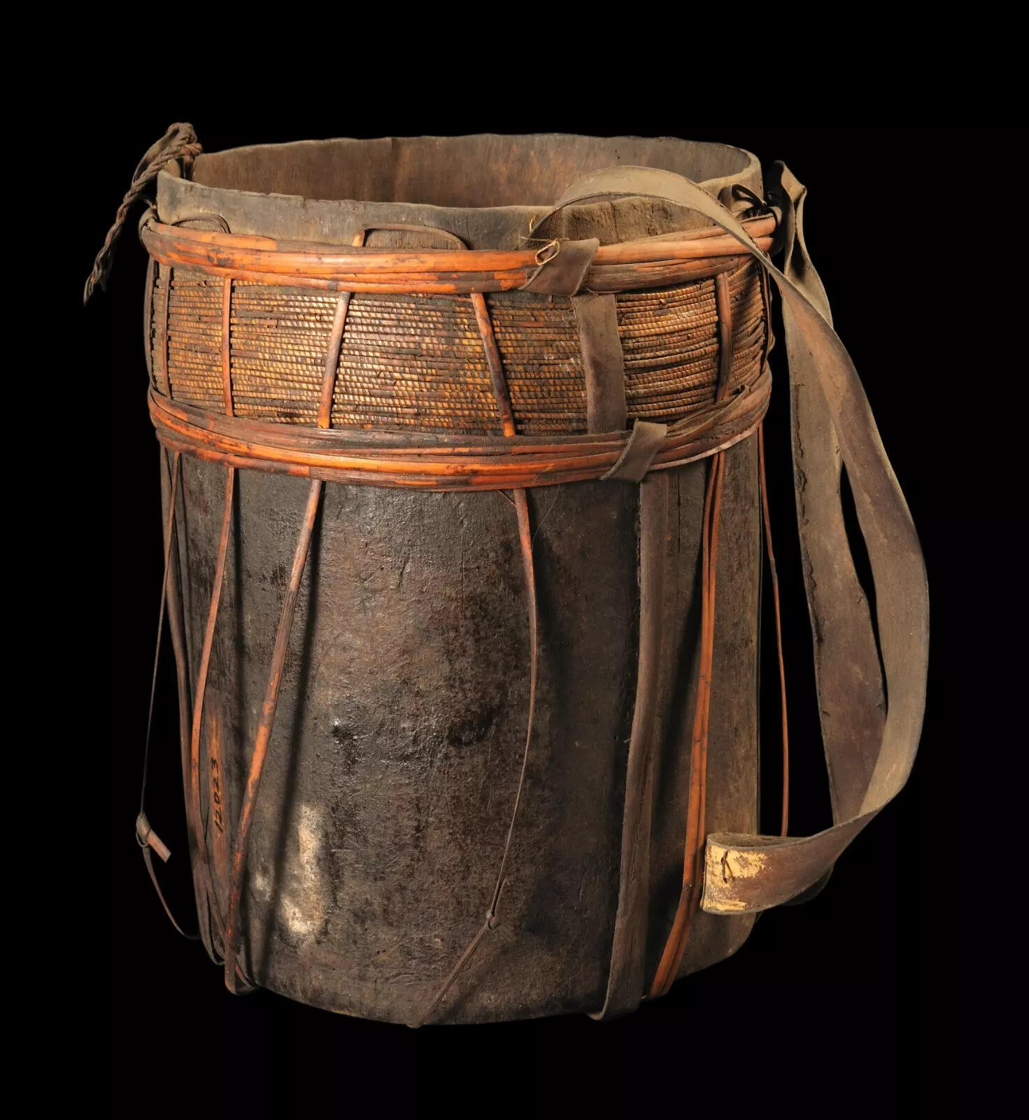 This rustic wooden bucket, crafted in a sturdy cylindrical shape, is a beautiful blend of natural materials and traditional utility