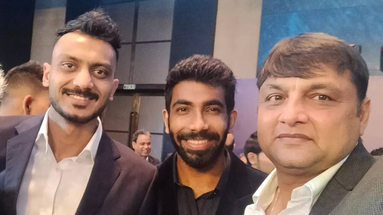 Axar Patel, Jasprit Bumrah, and Hitesh Majumdar