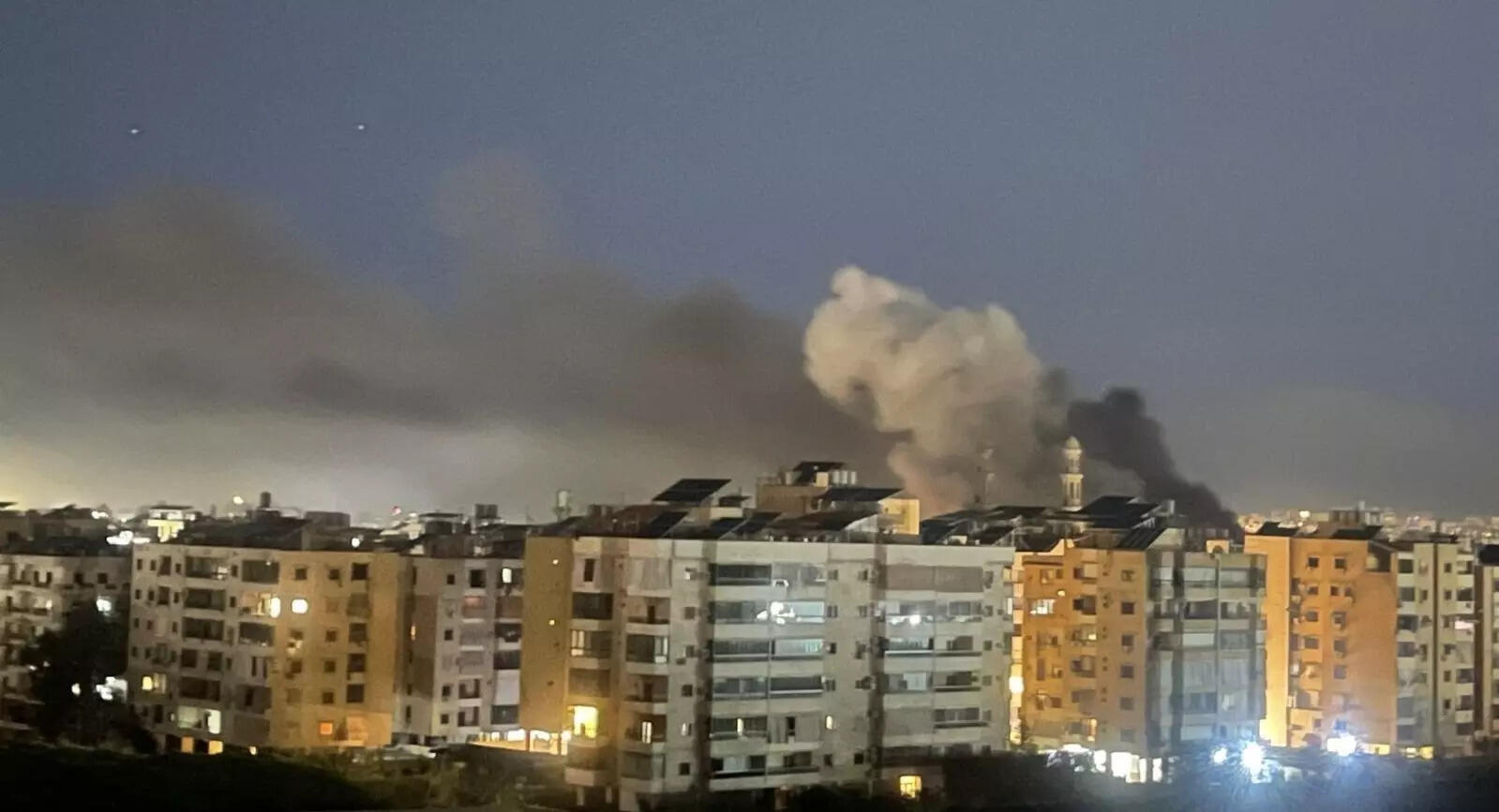 Thick smoke billowing from buildings after strikes on buildings in Beirut  (Image: Habib Al-Badawi/ Beirut)