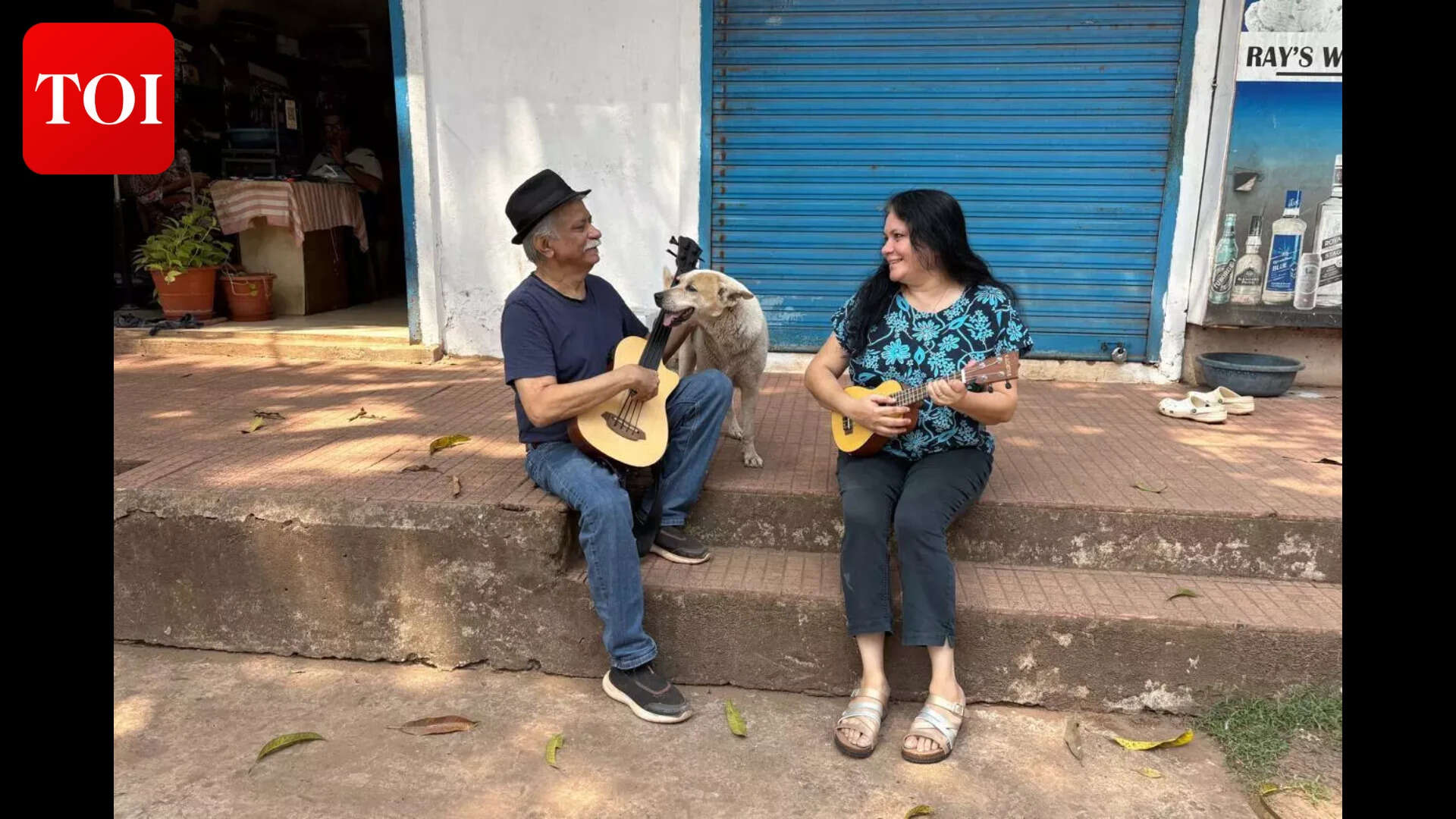 Musician Colin Dcruz, his wife Diana and pet Pinky playing the guitar