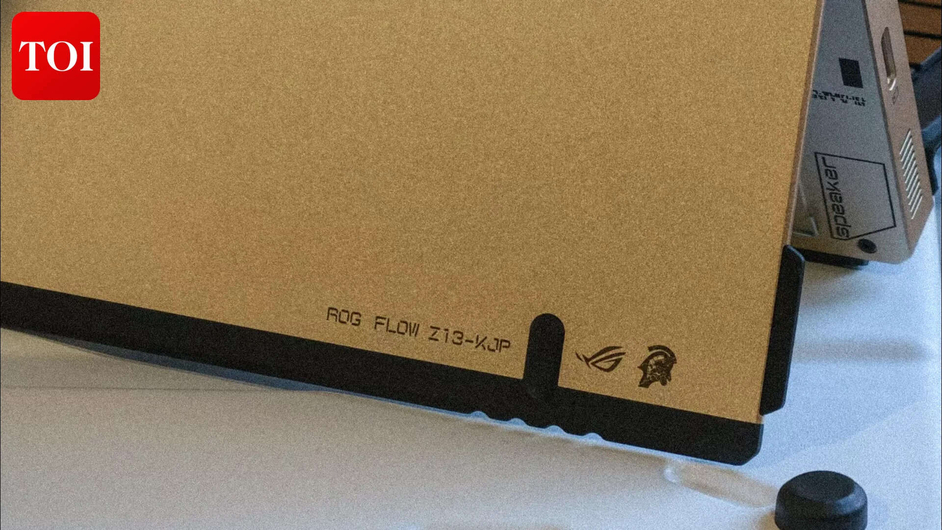 Two logos, one corner—ROG and Kojima Productions sharing the same real estate, and somehow neither one feels like an afterthought.