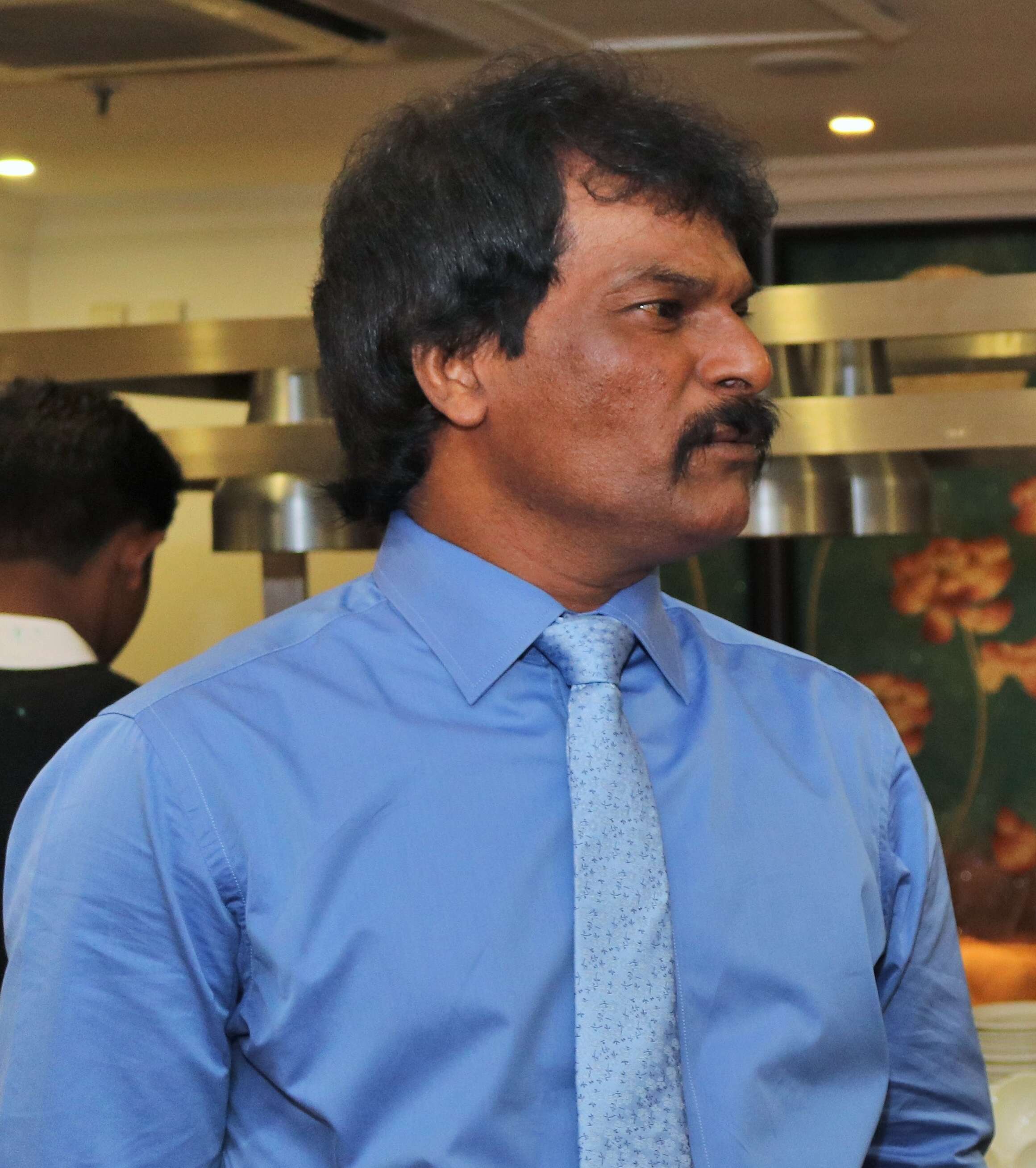 Dhanraj Pillay talking to a member of the organisers - Copy
