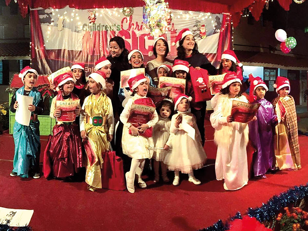 Michelle Fanthome (in the centre) with a group of kids celebrating Christmas (BCCL)