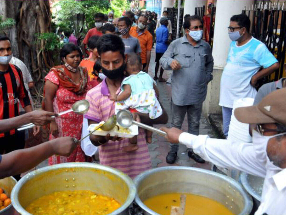 Volunteers distribute food to the needy during Covid-induced lockdown in Kolkata. (PTI Photo/Swapan Mahapatra)
