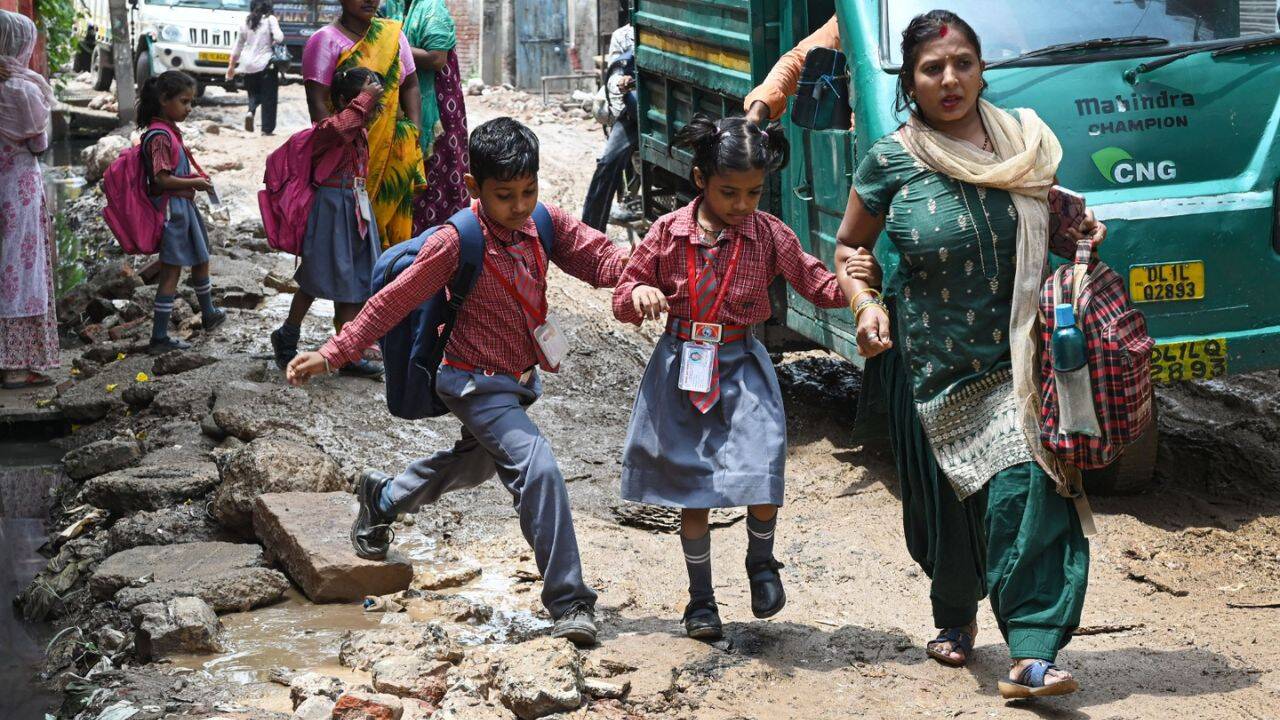Parents report children often arrive at school wearing slippers due to the mud