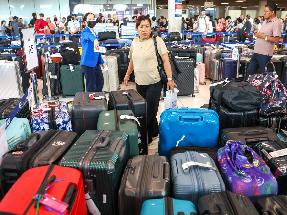 Delayed baggage from Thai Airways, after heavy rain and flooding, at Suvarnabhumi International Airport in Bangkok