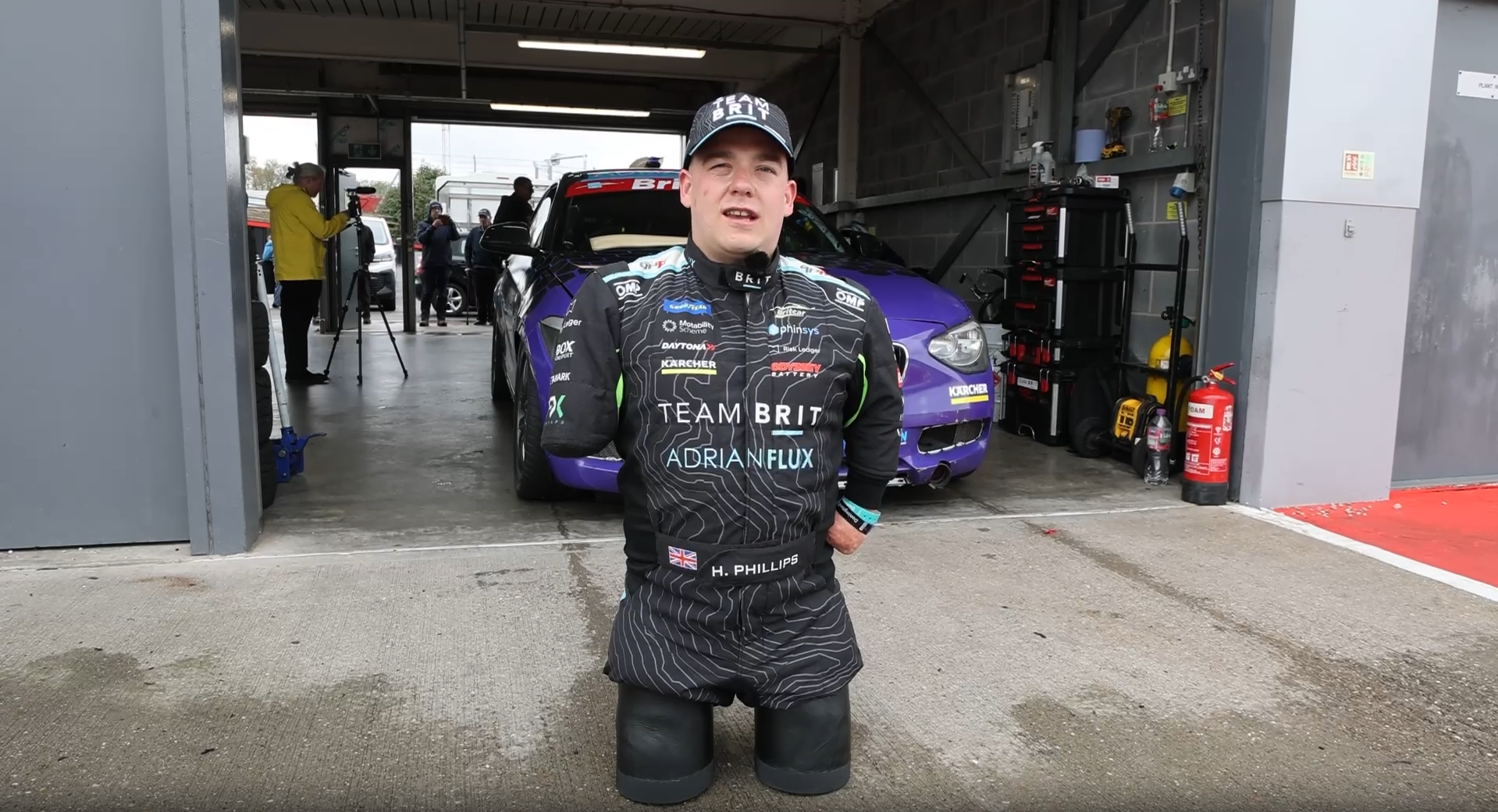 Harvey Phillips, a quadruple amputee, steers Team BRIT's race car using a specially adapted 3D-printed aid.