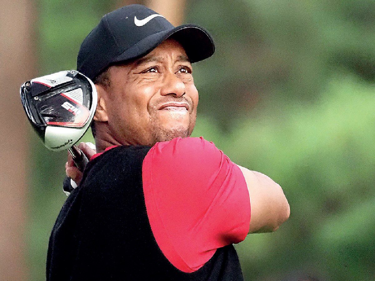 Tiger Woods equals record, has sights on 2020 Olympics