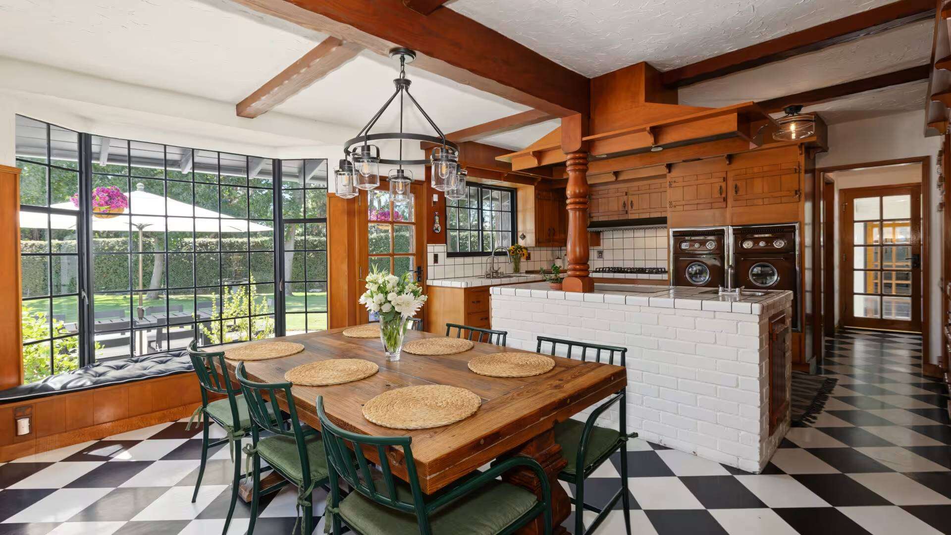 The property features stables, a barn, tack storage and a fenced riding arena.