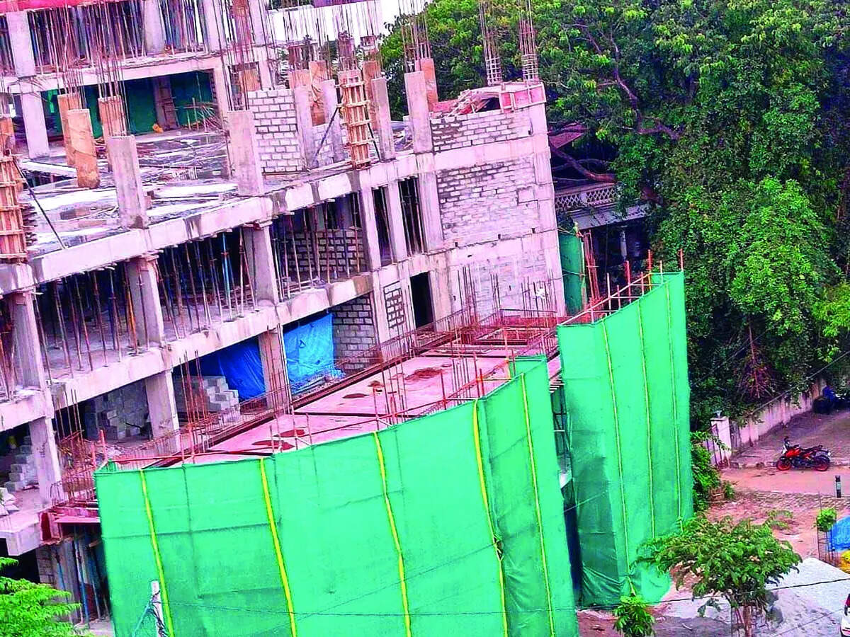 Encroaching Ramp BBMP fines builder, sacks officials over footpath ramp encroachment