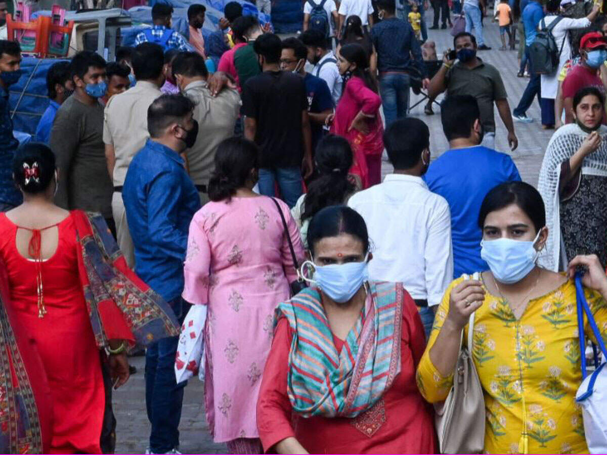 People throng Sarojini Nagar market for shopping after authorities eased a lockdown imposed as a preventive measure to curb the spread of the Covid-19 coronavirus, in New Delhi on June 19. (Photo by Prakash SINGH / AFP)