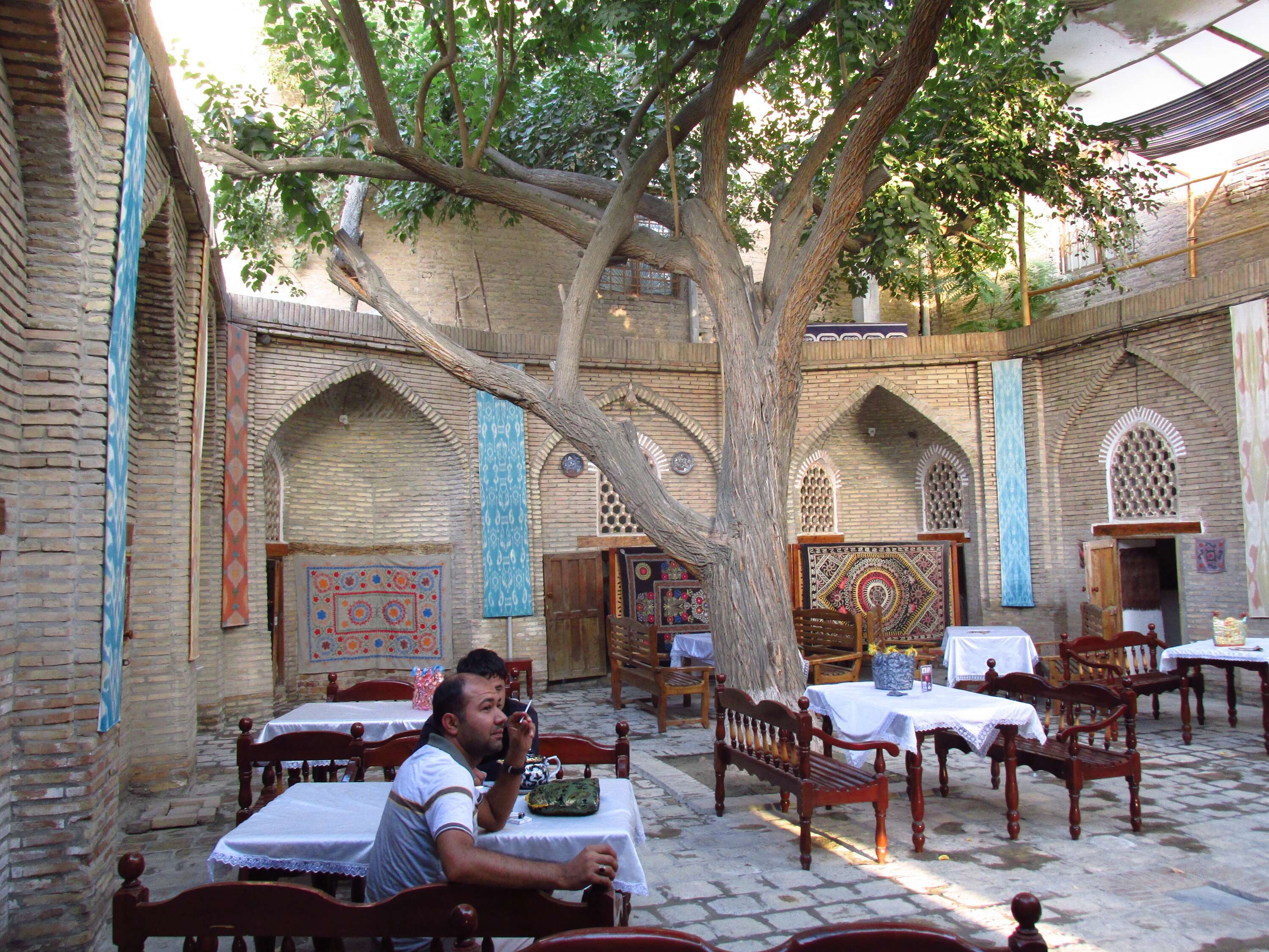 An open air restaurant inside  Addurakhmani Alam Madrassa in Bukhara, Uzbekistan